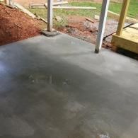 Residential landscaping project with stone borders and mulch beds