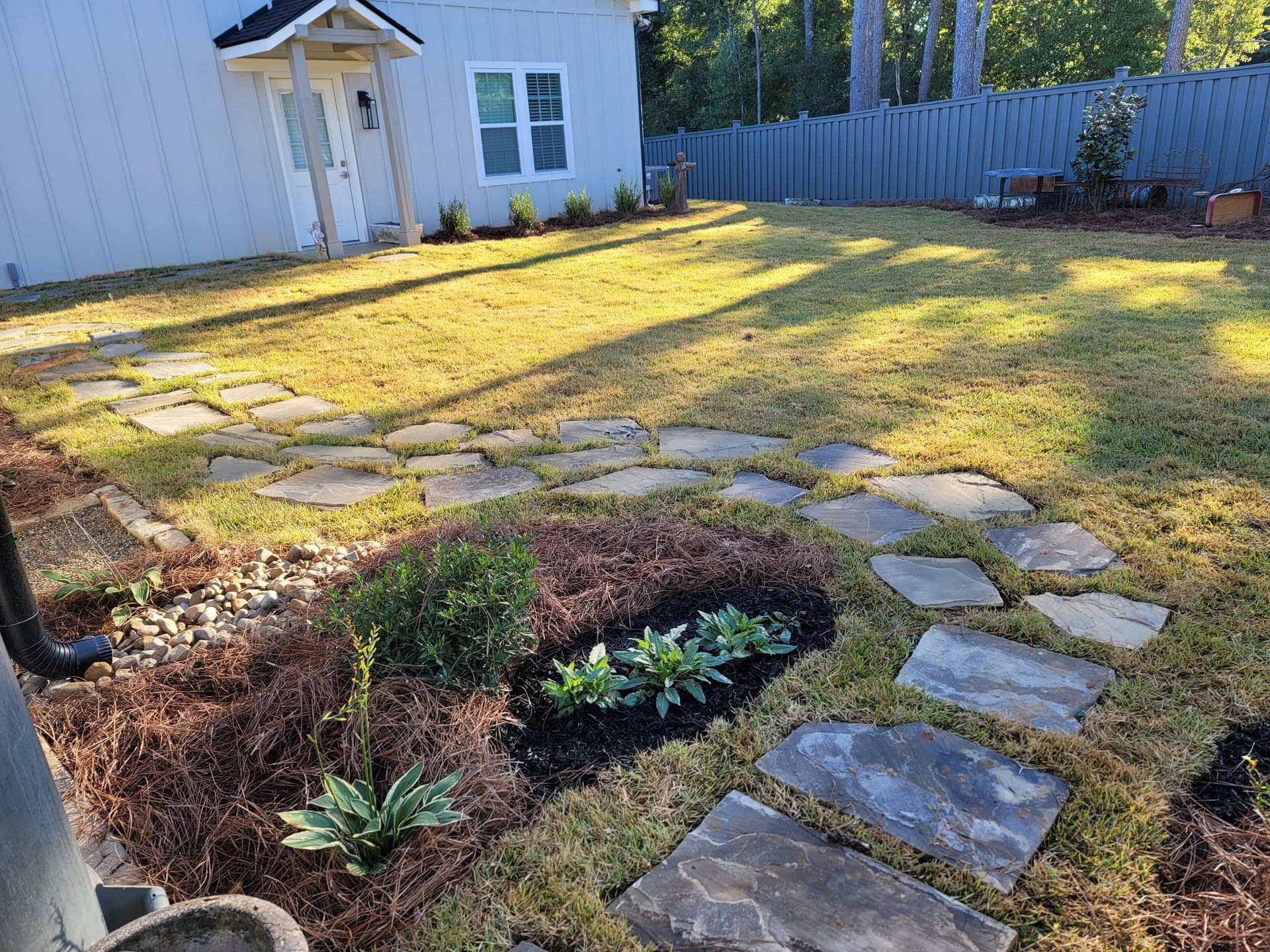 Commercial landscaping project with trimmed hedges and seasonal plantings