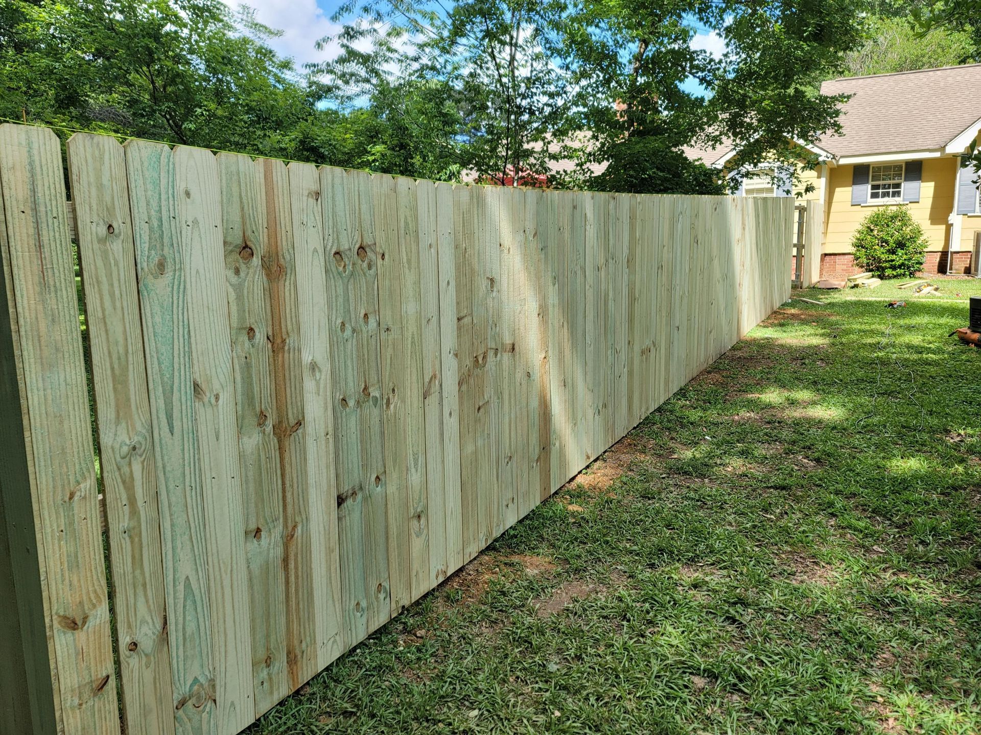 Vinyl fencing with clean white finish installed for a residential client